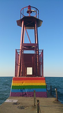 Beacon at Kathy Osterman beach with a painted rainbow flag