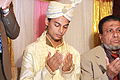 Groom is praying according to Muslim marriage rituals