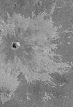 Bright rays caused by impact throwing out a bright lower layer.  Some bright layers contain hydrated minerals.  Picture taken by Mars Global Surveyor.  Location is Memnonia quadrangle.