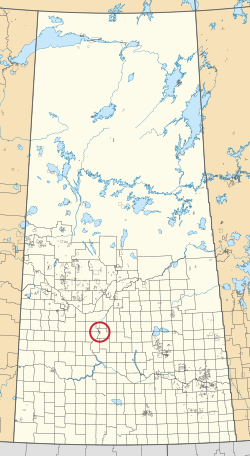 Saskatchewan vilayetinin 297 kırsal belediyesini ve yüzlerce küçük Kızılderili rezervini gösteren bir haritası. Biri kırmızı bir daire ile vurgulanmıştır.