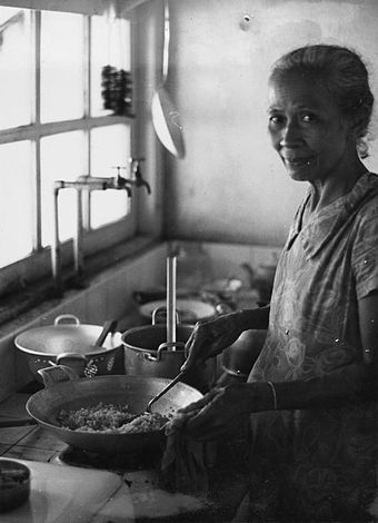 A woman cooking nasi goreng in Indonesia.