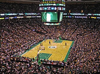 Professional basketball game between the Celtics and Timberwolves in a crowded arena