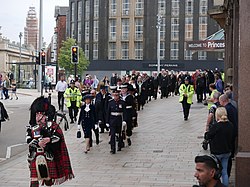 The procession reaches Queen Victoria Square