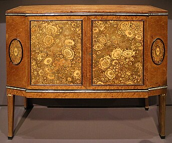 Chest of drawers, a highly simplified reinterpretation of the Louis XVI style; by Clément Mère; 1910; maple, ebony, leather and ivory; 87.5 x 96 x 37 cm; Musée d'Orsay, Paris[107]