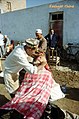 Close shaves at the Sunday market Kashgar - panoramio.jpg