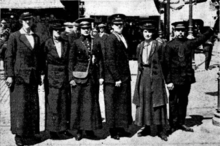 From the Coventry Herald 11 June 1915. Caption reads: Five of the newly-appointed lady tram conductresses in Coventry are photographed above. The lady in the centre of the group wears the full official uniform with which all the new workers are being supplied; a neat blue serge costume with white metal Corporation buttons and a grey straw military cap. The object of appointing women is of course to release male tram conductors of military age who wish to enlist. Occupied at present in learning new duties, the ladies are displaying marked intelligence, and it is believed they will make smart and efficient conductresses. Conductresses for the Local Tramcars.png