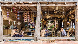 Craftmen at work, bamboo basket weaving and textile mobile sculptures, in Heuan Chan heritage house, Luang Prabang, Laos Craftmen at work, bamboo basket weaving and textile mobile sculptures, in Heuan Chan heritage house, Luang Prabang, Laos.jpg