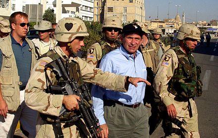 Dep. Sec. Wolfowitz is escorted by Army General David Petraeus he tours Mosul, Iraq, July 21, 2003