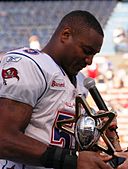 Derrick Brooks with 2006 Pro Bowl MVP trophy 060210-N-4856G-129.jpg