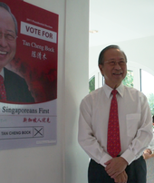 Tan Cheng Bock, a candidate in the 2011 presidential election, standing next to one of his campaign posters Dr-Tan-Cheng-Bock-at-home-on-Nomination-Day-1.png