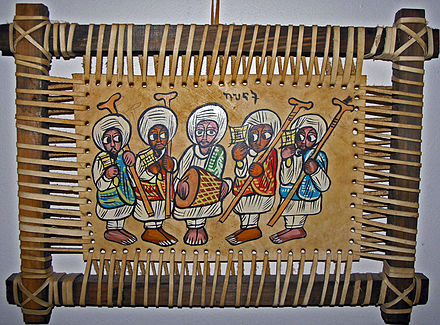 This leather painting depicts Ethiopian Orthodox priests playing sistra and a drum