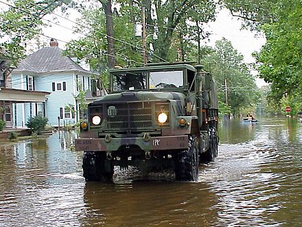 National Guard transporting government documents from flooded building, Tarboro, NC. FEMA#495, taken by Sgt. 1st Class Eric Wedeking 16 September 1999.