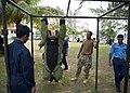 Flickr - Official U.S. Navy Imagery - A Explosive Ordnance Disposal Technician performs pull-ups while wearing an EOD bomb suit..jpg