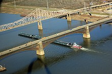 Barges pass beneath the Eads and Martin Luther King bridges at St. Louis Gfp-missouri-st-louis-boat-under-bridge.jpg