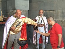 Hetan priest conducting a ceremony at Garni Temple Hetan priest officiating at Garni Temple, Armenia 7.jpg