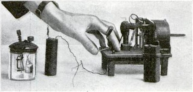 Hughes wireless apparatus, a clockwork driven spark transmitter and battery (right) and a modified version of his carbon block microphone (left) which