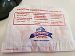 The wrapper of a hamburger from In-N-Out Burger featuring a bible verse from the Book of Revelation. In-n-out Burger verses - 2.jpg
