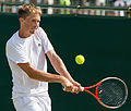 Joshua Milton competing in the second round of the 2015 Wimbledon Qualifying Tournament at the Bank of England Sports Grounds in Roehampton, England. The winners of three rounds of competition qualify for the main draw of Wimbledon the following week.