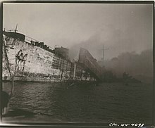 The burned hulk of LST-39 on 21 May 1944. LST-39 (ship).jpg