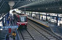 Light rail car at SITEUR's Unidad Deportiva station in 1990.jpg