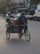 A mohinga trishaw peddler in Mandalay will stop for customers.