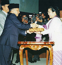 Megawati being congratulated for winning the MPR special session in 2001, after Wahid's impeachment Megawati Sukarnoputri presidential election, 2001.jpg