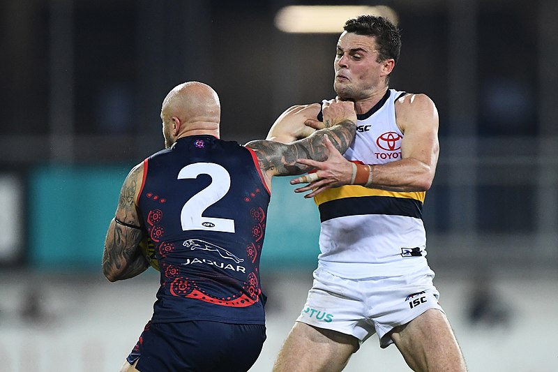 File:Nathan Jones fending off Brad Crouch.jpg