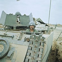 Normie Rowe in an M113 armoured personnel carrier in South Vietnam Normie Rowe in a M113 APC during 1969.jpg