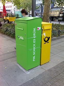 PIN Group post box (green) deliberately placed next to a Deutsche Post box PINGroupGermany.jpg