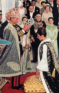 Mohammad Reza Shah crowning his wife, Empress Farah at their coronation ceremony in 1967. Pahlavi Coronation.png