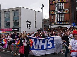 A large NHS banner carried by CHCP personnel at the 2022 Pride in Hull parade.