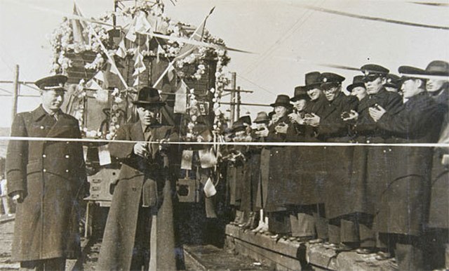 Ceremony commemorating the completion of the electrification of the Yangdŏk–Sinch'ang section of the P'yŏngwŏn Line in 1948.
