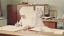 Zakaria in 1991 Rita Puspa signing a letter during seminar.jpg