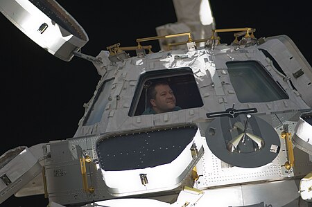 ไฟล์:STS-130_Nicholas_Patrick_looks_through_Cupola.jpg