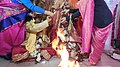 Sindur daan Hindu ritual as the groom is full blind ladies assisting her to complete rituals at Voice Of World Kolkata 39