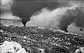 A pall of smoke hanging over the habour in Suda Bay where two ships, hit by German bombers, burn themselves out. - May 1941