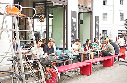 Café customers in Berlin Mitte using Wi-Fi devices