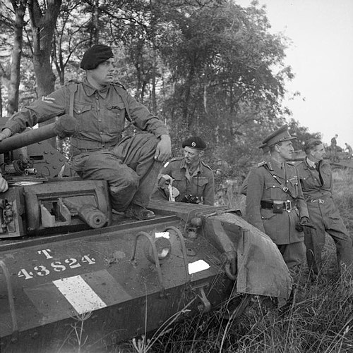 Lieutenant General Sir Bernard Paget and Anthony Eden, the Foreign Secretary, watch an exercise involving the 42nd Armoured Division near Malton, Nort