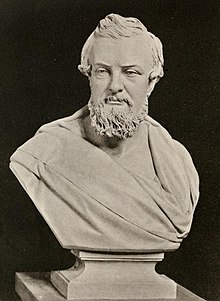 Black-and-white photograph of a marble bust of a bearded man