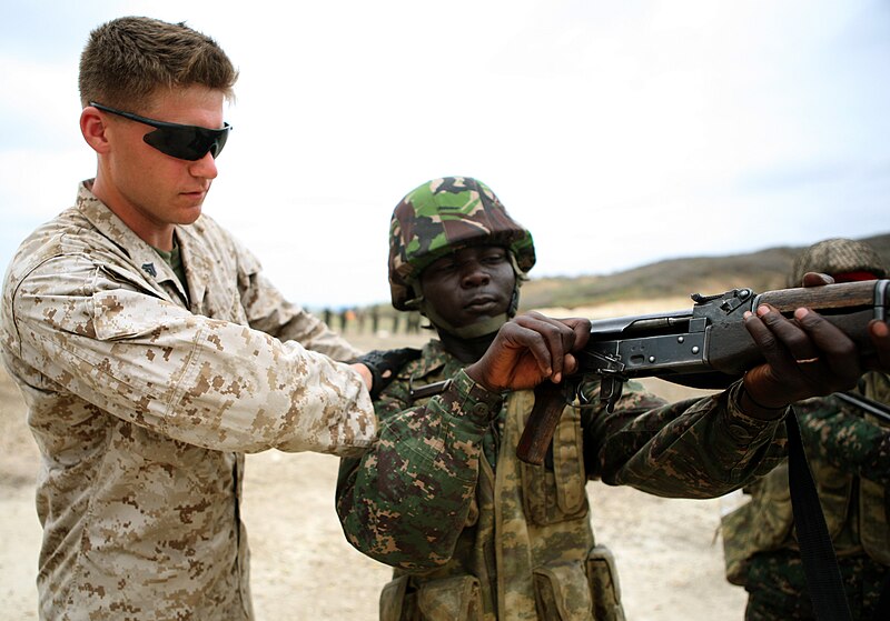 File:U.S. Marine Corps Cpl. John P. Maggard, a range coach with the 3rd Battalion, 25th Marine Regiment, inspects the chamber of a Gambian soldier's rifle during combat marksmanship training July 15, 2012, in Thies 120715-M-XI134-1660.jpg