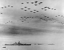 Part of the mass flypast on 2 September, over the Missouri (left) USS Missouri (BB-63) flyover, Tokyo Bay, 2 September 1945 (80-G-421130).jpg