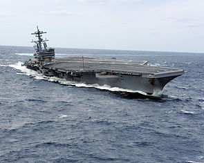 US Navy 100227-N-1854W-716 USS George H.W. Bush (CVN 77) heels hard to starboard during high-speed drills.jpg