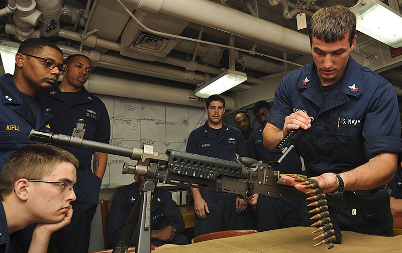 File:US Navy 110614-N-YM590-103 Gunner's Mate 2nd Class Derek M. Saddison, right, conducts weapons familiarization training on an M240B machine gun aboa.jpg