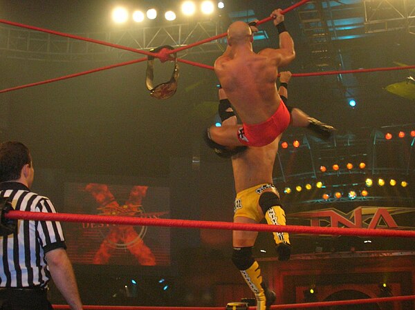 A.J. Styles (yellow trunks) and Christopher Daniels (red trunks) during an Ultimate X match in 2006