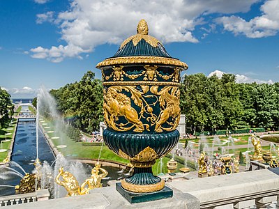 An 18th century vase at the Grand Peterhof Palace, Saint Petersburg, Russia. In the background, parts of the Grand Cascade and the Sea Canal of Peterhof are visible.