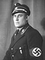 Wilhelm Rediess (1900-45) SS-Standartenführer Allgemeine-SS black uniform c. 1933–34 Portrait collection of Nazi party NSDAP members National Archives NARA Unrestricted No known copyright 242-HLT-4 (cropped).jpg