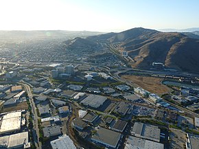 Bayshore Freeway (center of picture) in South San Francisco and Oyster Point, looking west (2010); Sign Hill and the San Bruno Mountain are in the background Zeppelin-ride-020100925-167 (5029377202).jpg