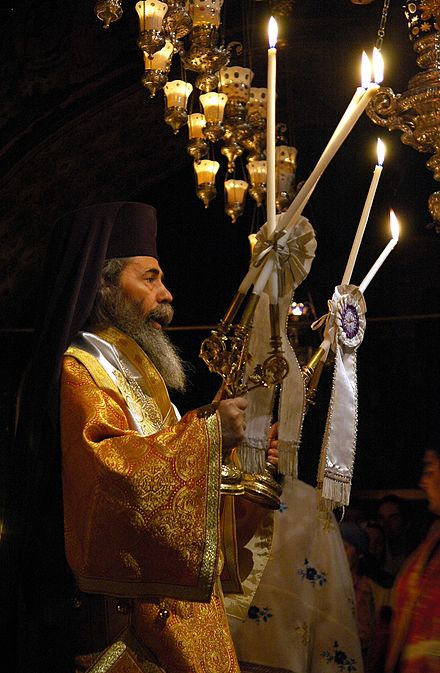 Patriarch Theophilus III of Jerusalem, giving the blessing with Dikirion and Trikion.