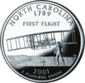 מטבע של מדינת צפון קרוליינה שמציג Flyer I של האחים רייט אשר ביצע את הטיסה הראשונה ב־1903 בקיטי הוק.