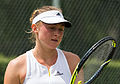 Aliaksandra Sasnovich competing in the third round of the 2015 Wimbledon Qualifying Tournament at the Bank of England Sports Grounds in Roehampton, England. The winners of three rounds of competition qualify for the main draw of Wimbledon the following week.